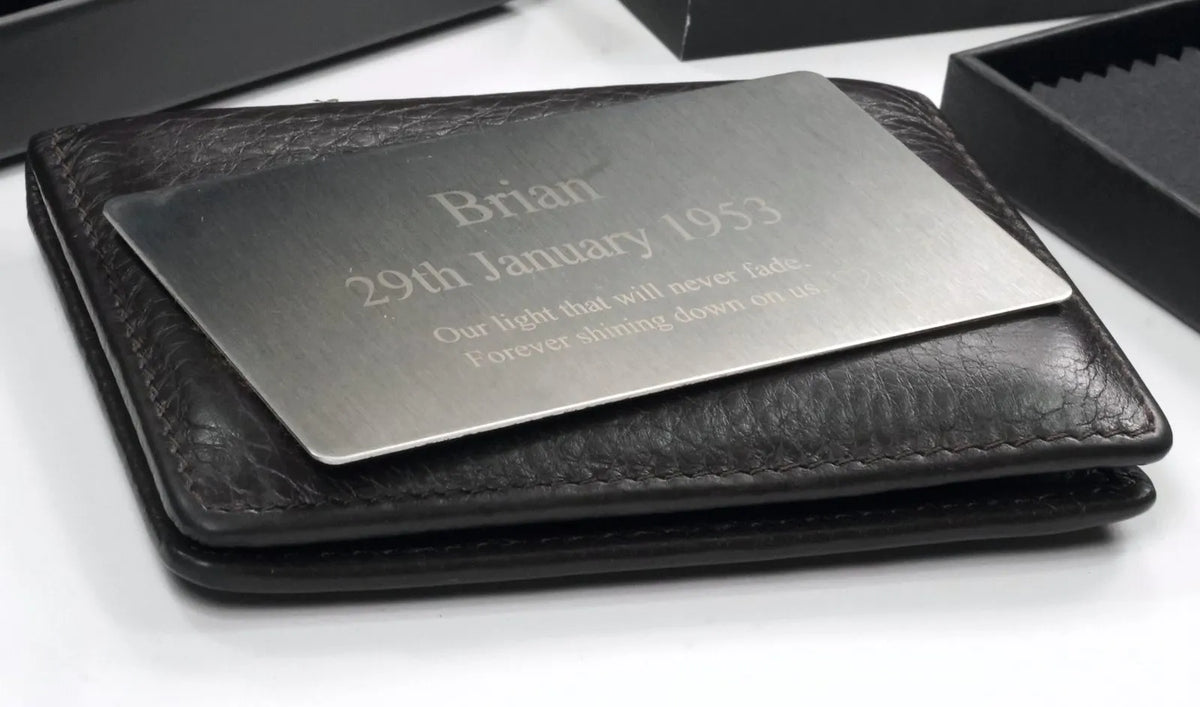 Engraved steel star card slipped into a leather wallet