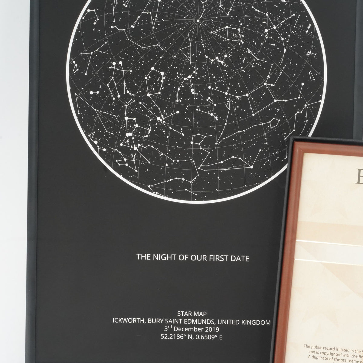 Framed black star map titled 'The night of our first date' beside the framed deed
