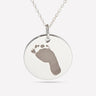 Silver pendant engraved with a baby's footprint