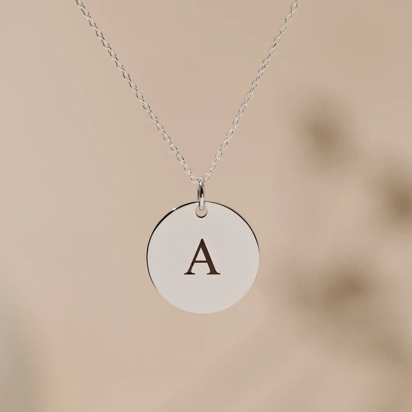 Silver pendant engraved with the letter A