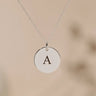 Silver pendant engraved with an initial