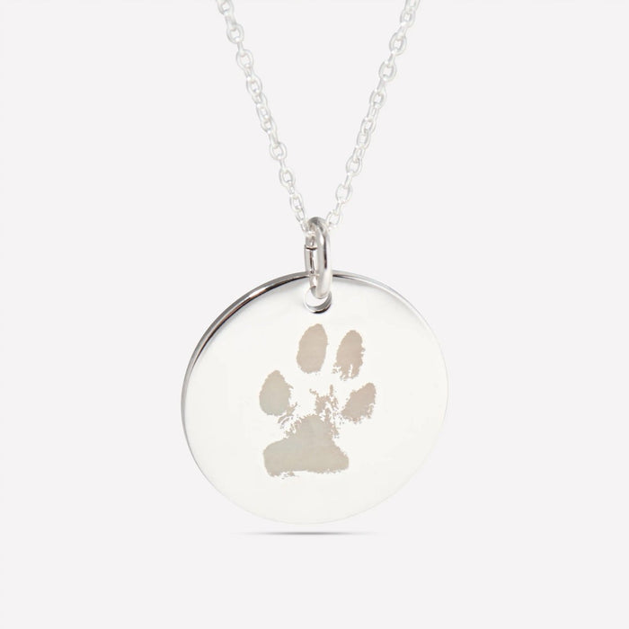 Paw print engraved on a silver pendant
