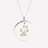 Silver pendant engraved with a pet's paw print