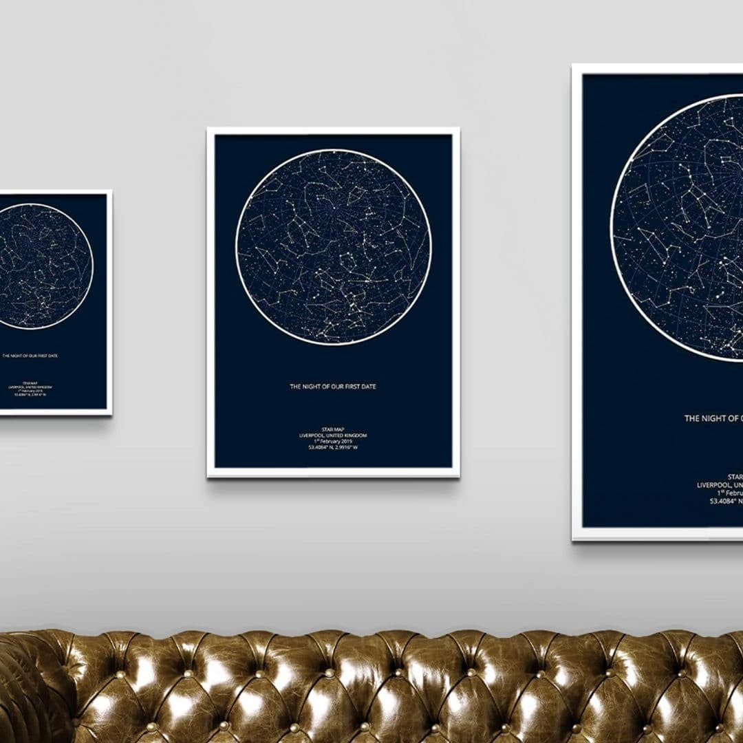 Three star map prints on a wall