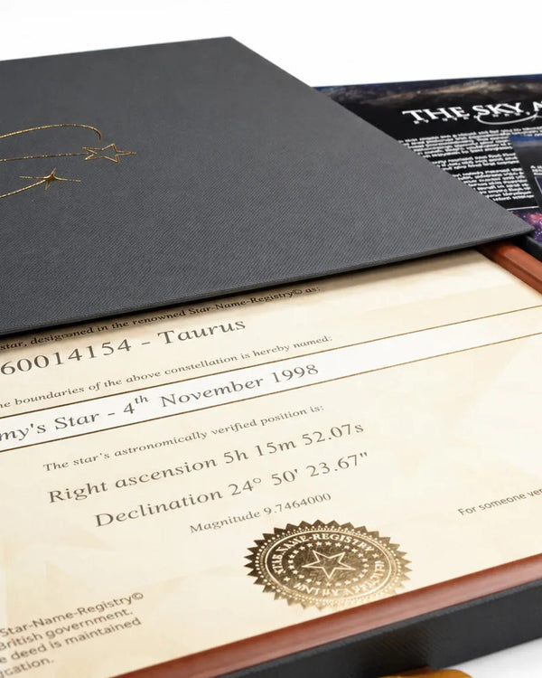 Framed Extra Bright Star Name Deed in an open black gift box, with the star's coordinates and seal
