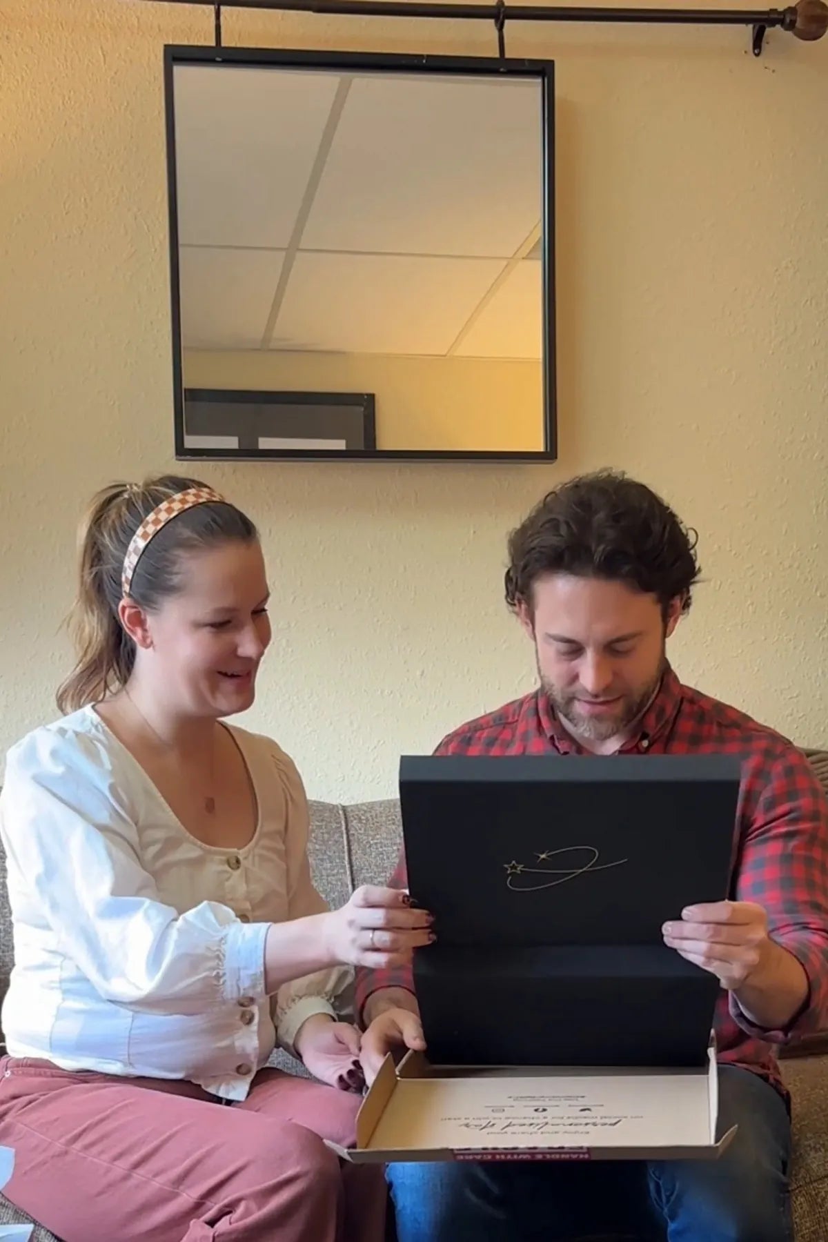 Couple on the sofa with the star deed gift set