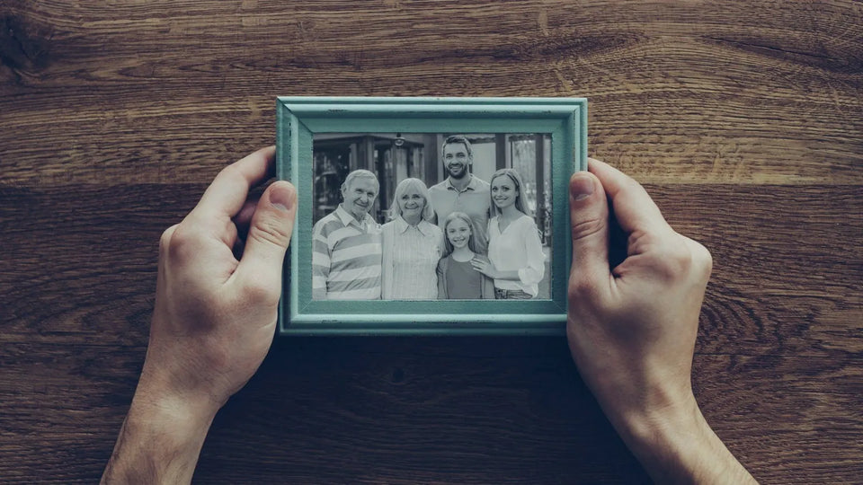 Family looking at a framed star certificate together