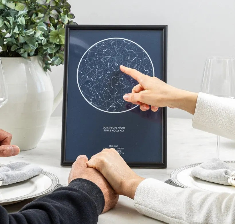 Framed Starniri star map of the night sky on a dining table